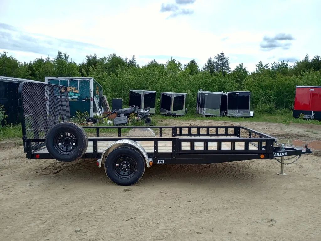 2024 PJ Trailers 14 ft Utility – Side Loading Ramps – Full side profile of the black powder coated open utility trailer