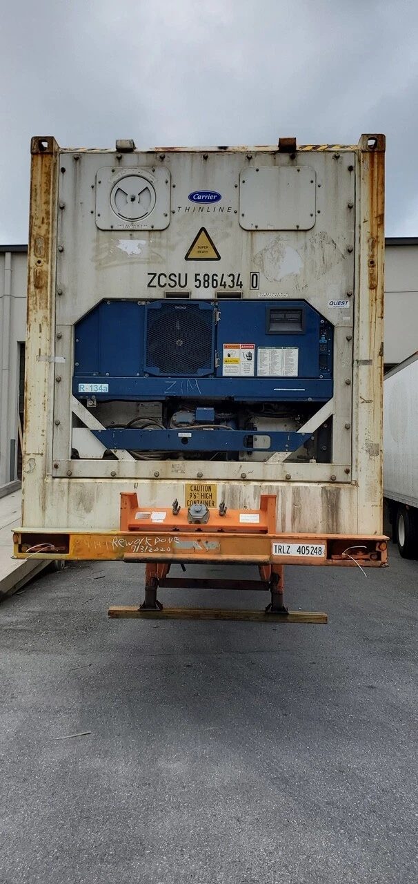 40ft High Cube Reefer Container – Non-Working, Insulated Storage – straight-on refrigeration end of weathered insulated shipping container