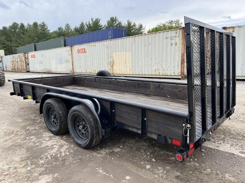 2021 Big Tex 16 ft Utility Trailer – Ramp Gate & Spare – Left rear three-quarter view of the trailer showing the wooden side boards