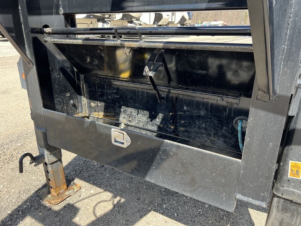 2023 Big Tex 40 ft Equipment Trailer – Slide-Out Ramps – Open metal storage tool box located at the front of the trailer frame