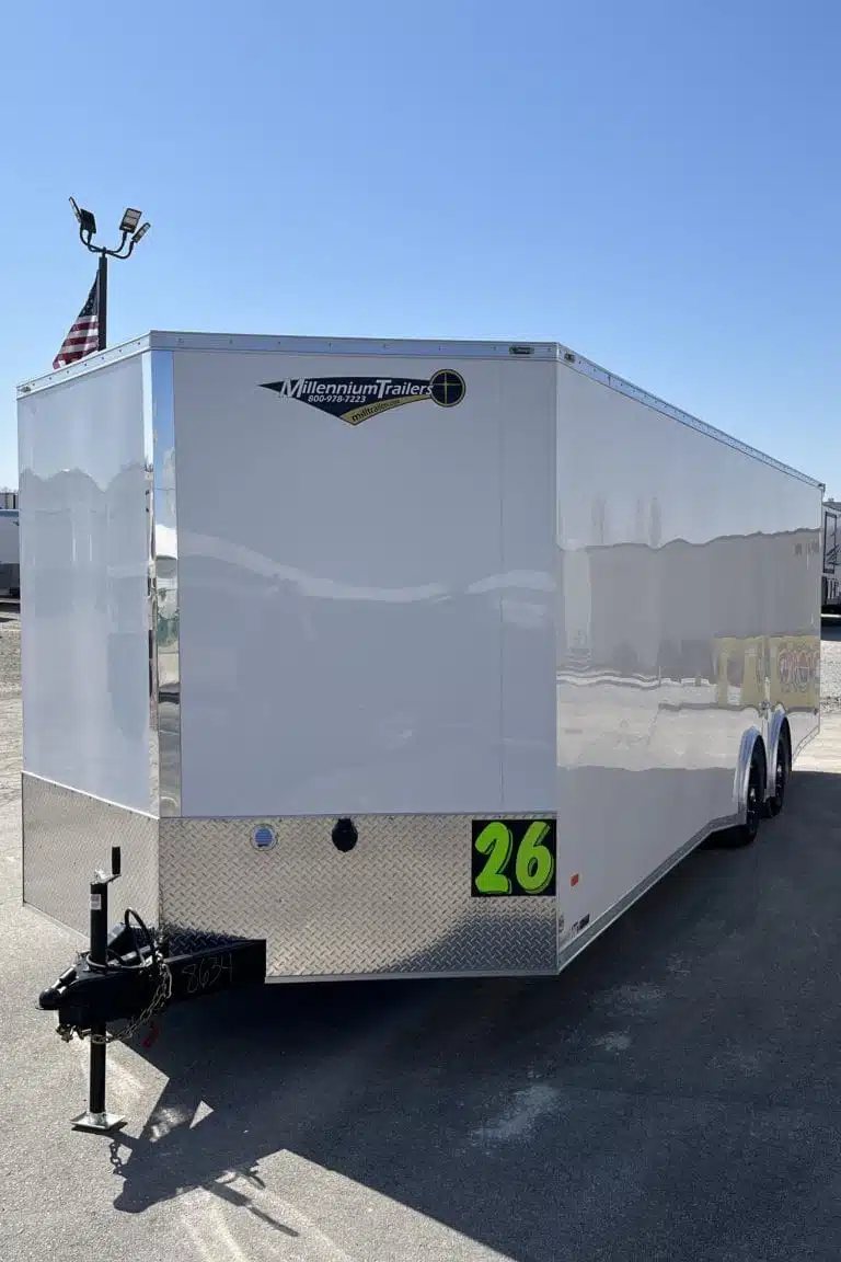2025 Millennium Blaze 26 ft Car Hauler – Cabinets – Front and side exterior view of white trailer with dealership sticker and numbering