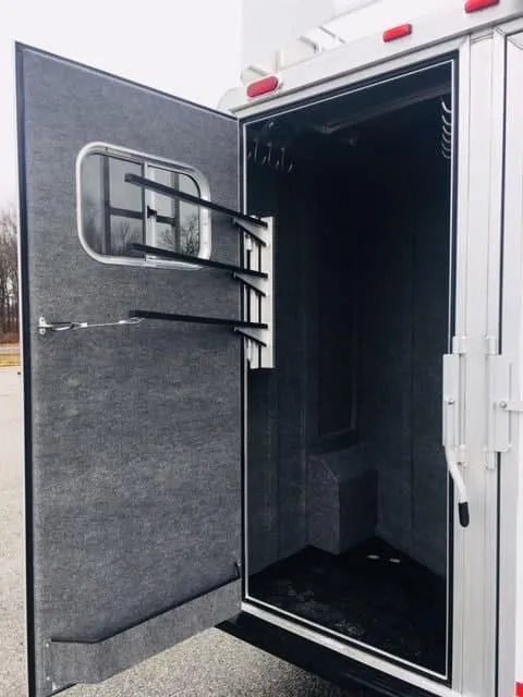 2018 Platinum Coach 3 Horse Bumper Pull – Rear Tack – Open tack room door with blanket bars and interior carpeted walls