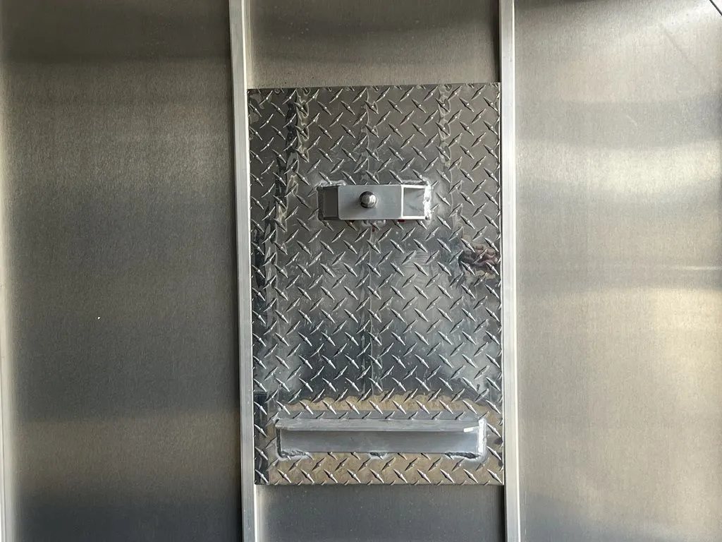 2021 Mission Trailers 2-Place Hybrid – Blackout Package – Aluminum diamond plate bracket mounted on the interior wall of the trailer