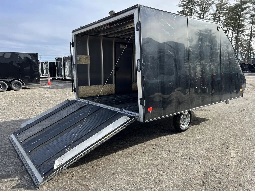 2021 Mission Trailers 2-Place Hybrid – Blackout Package – Angled view of the open rear ramp door showing the interior tracks