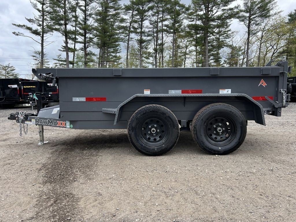 2024 RawMaxx 10 ft Dump Trailer – Shadow Grey – Full side profile of the grey dump trailer showing the two wheels and frame