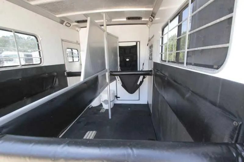1999 Sundowner 20 ft Horse Trailer – Weekender – View looking into the horse stalls from the rear with dividers visible