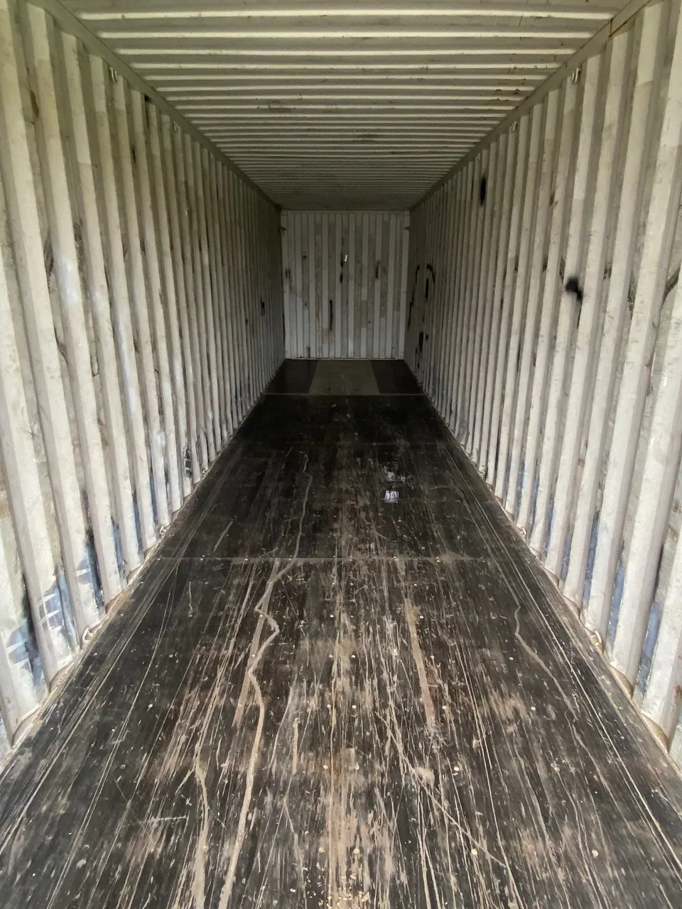 40ft High Cube Used Shipping Container – Lockable Cargo Doors – empty container interior with scuffed wooden floor and corrugated walls