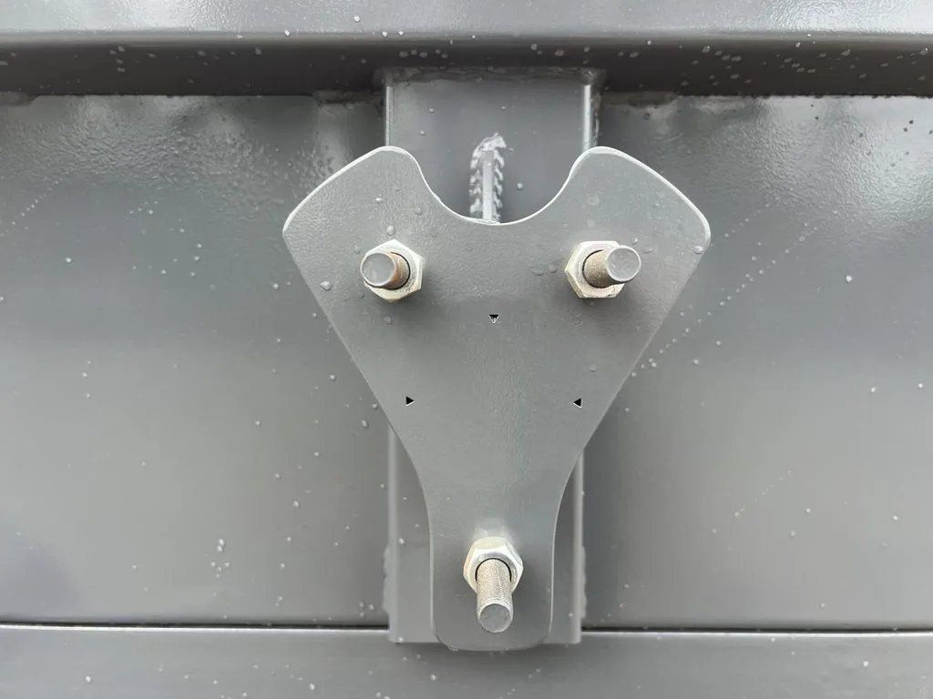 2024 RawMaxx 10 ft Dump Trailer – Shadow Grey – Close-up of a metal mounting bracket on the side of the trailer bed