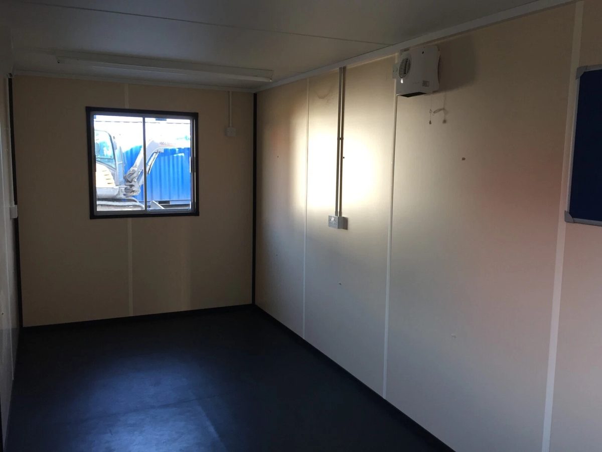20ft Portable Office Cabin – Insulated Steel Workspace – Empty office cabin with window and wall-mounted heater