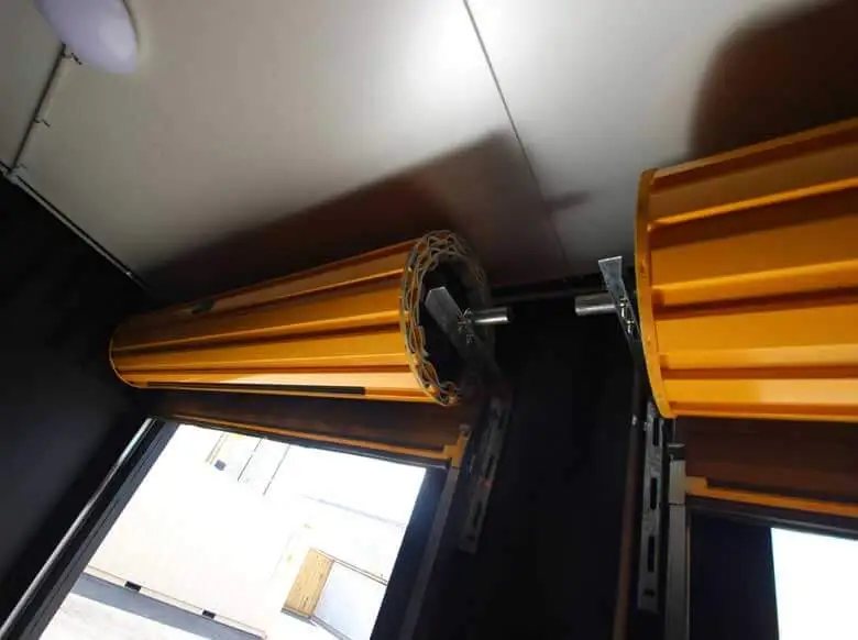 Trade Show Display Container – Lockable Steel Booth – Close up of the roller door mechanism and ceiling light inside the container