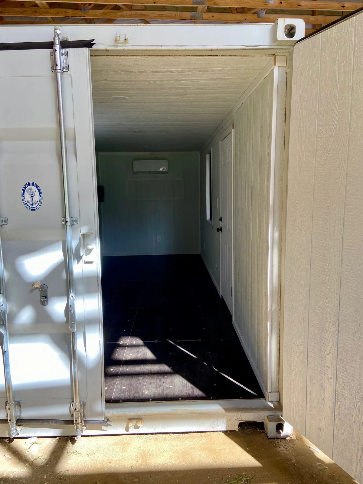 20ft Modular Container Office – LED Lighting, Two Windows – open cargo doorway into empty office with air conditioning
