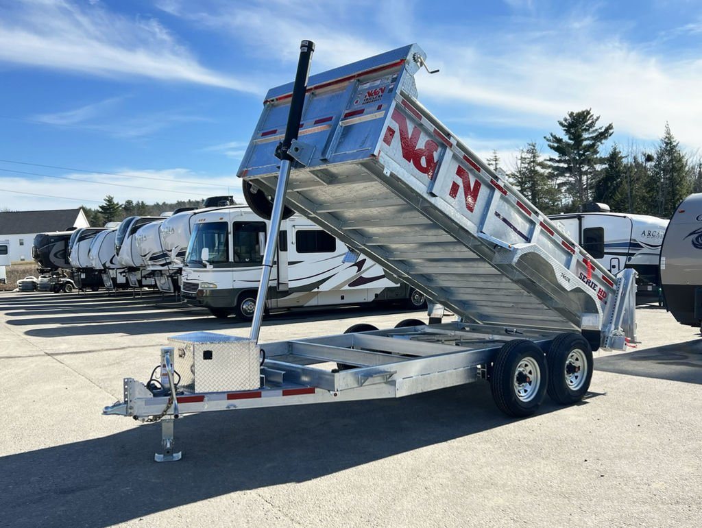 2024 N&N Trailers 14 ft Dump – Galvanized Steel – Front three-quarter view of the dump trailer with its bed fully tilted up