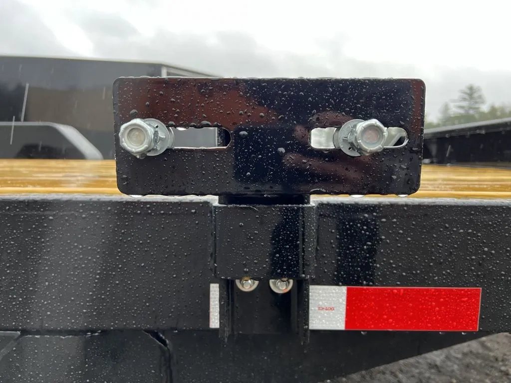 2024 Rice Trailers 16 ft Equipment Trailer – Toolbox – Close-up of a black metal mounting bracket with two silver bolts