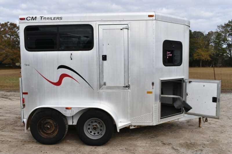 2001 CM Odyssey 2 Horse Trailer – Aluminum Floor – Side view with the tack compartment door swung fully open