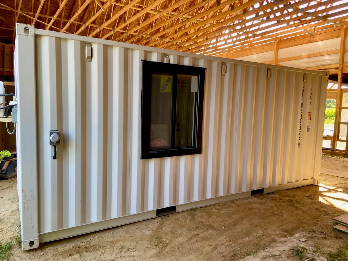 20ft Modular Container Office – LED Lighting, Two Windows – white container office side with black framed window under construction