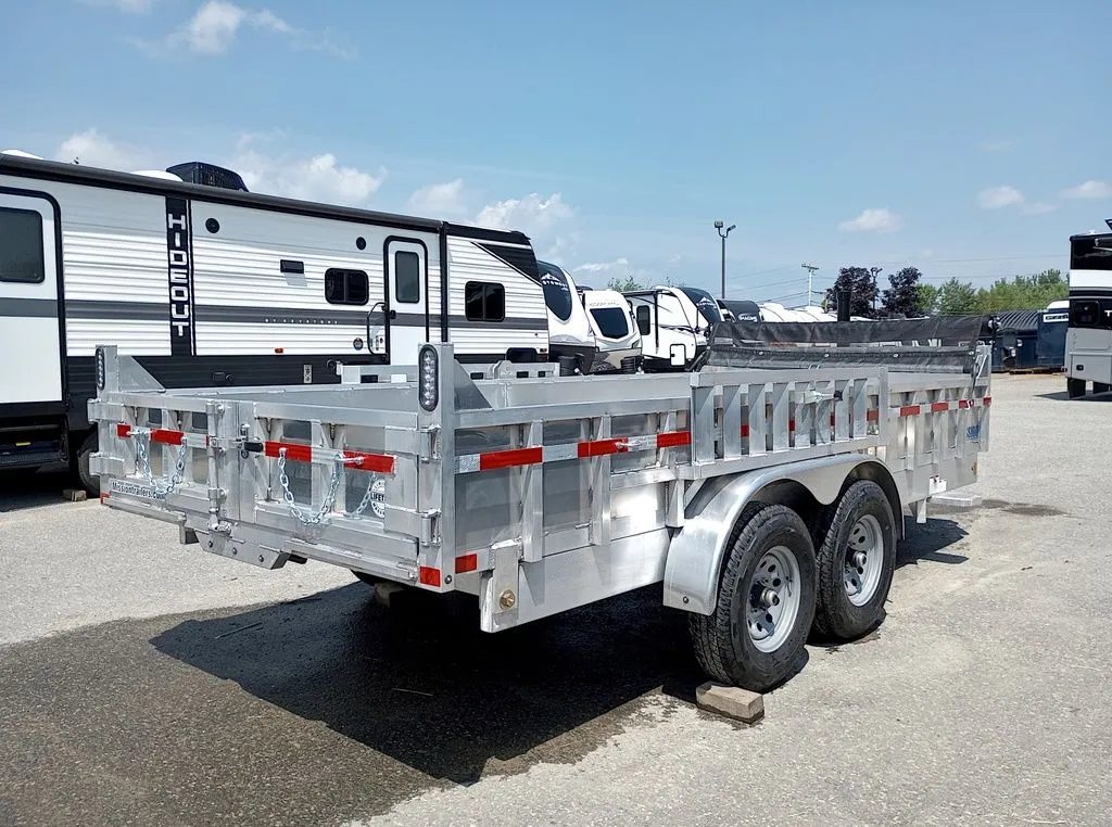2025 Mission Trailers 16 ft Dump Trailer – Aluminum – Rear three-quarter view of the trailer with barn doors closed