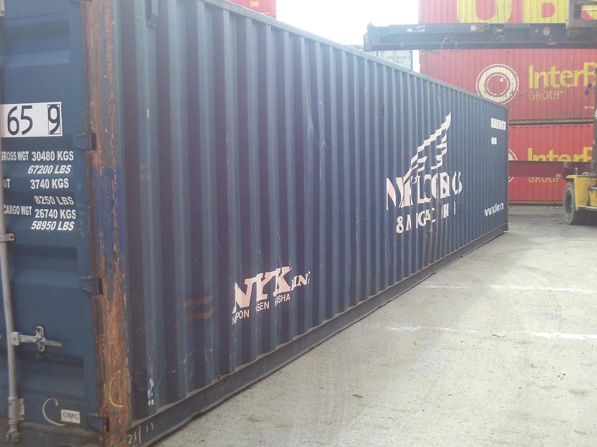40ft Used Shipping Container – Standard Height, Double Doors – angled exterior of weathered container in busy storage yard