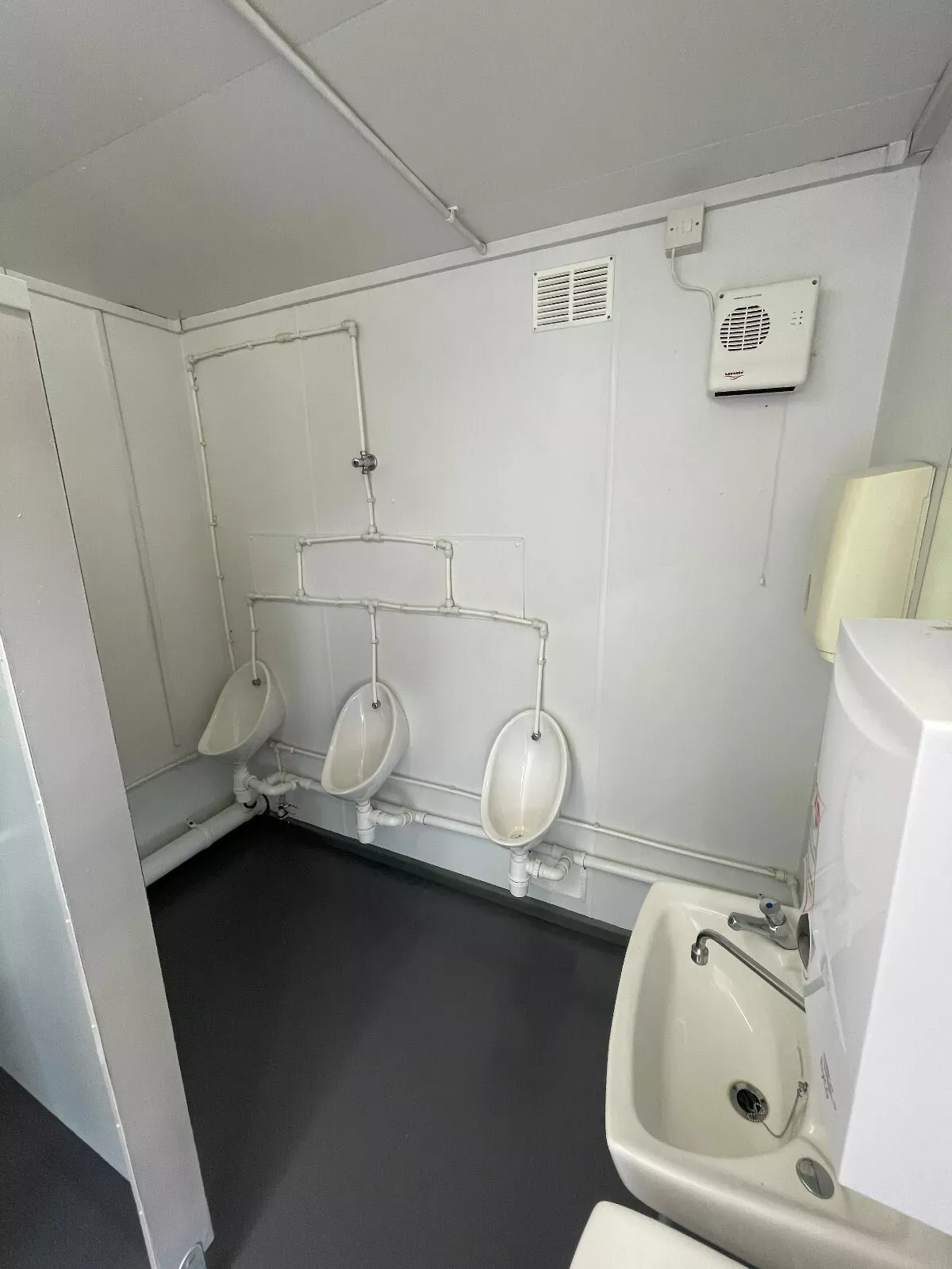 16ft × 9ft Modular Toilet Block – 3+1 Compartment Layout – Toilet block interior with three urinals and a washbasin