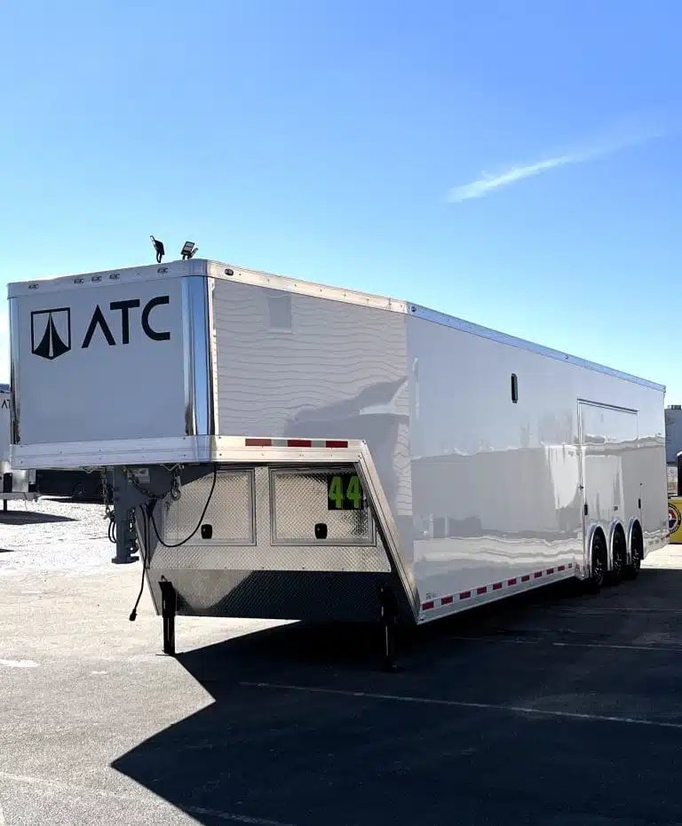 2026 ATC 44 ft Car Trailer – Aluminum Wheels – Rear three-quarter view of a white gooseneck trailer on asphalt