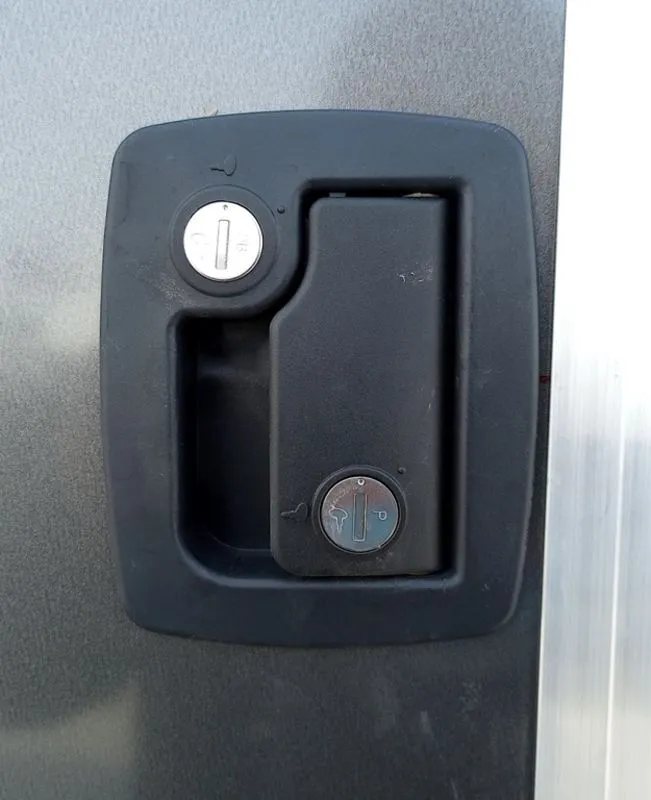 Mission Trailers Aluminum Crossover – Rear Canopy – Close-up of a black recessed door handle with dual locks