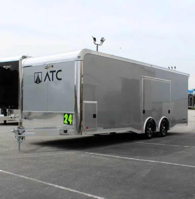 2026 ATC 24 ft Car Trailer – Silverfrost, Plus Package – Three quarter front view of a grey enclosed car trailer with aluminum trim