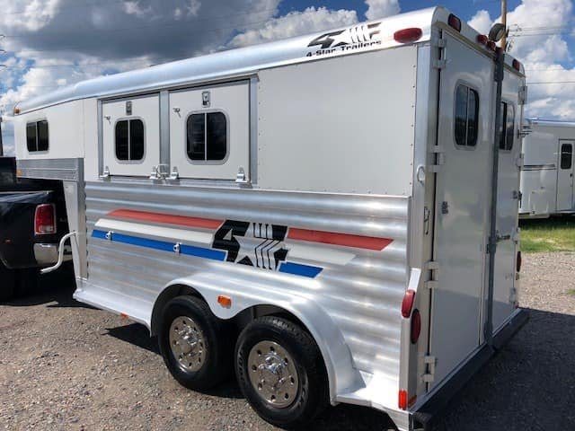 2004 4 Star 2 Horse Gooseneck Trailer – Slant Load, White – Rear three-quarter view from the passenger side showing the drop-down windows and decals