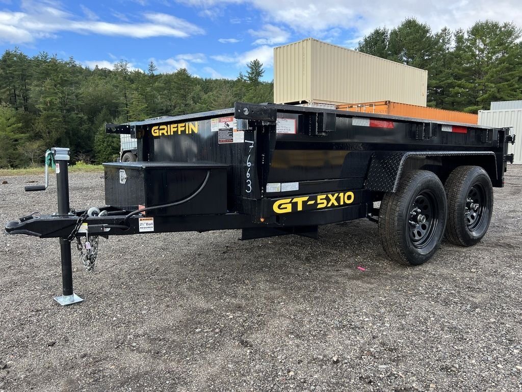 2024 Griffin Trailers 10 ft Dump – Barn Door Gate – A front three-quarter view of a black dump trailer on a gravel lot