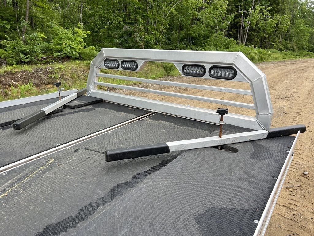 2022 Sno Pro 7 ft Sled Deck – Quad Ply Decking – Close up of the black textured deck surface and aluminum headache rack