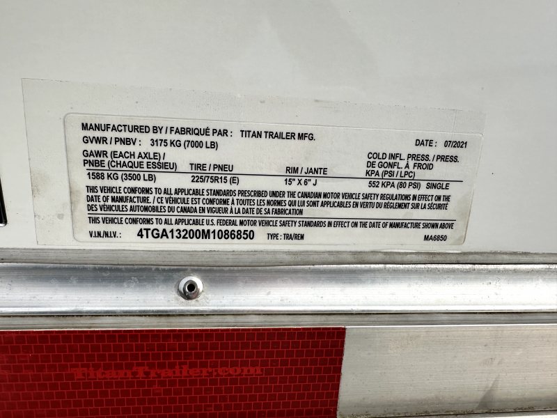 2021 Titan 2 Horse Bumper Pull Trailer – White, Slant Load – Close-up of manufacturer identification and VIN plate on the trailer frame