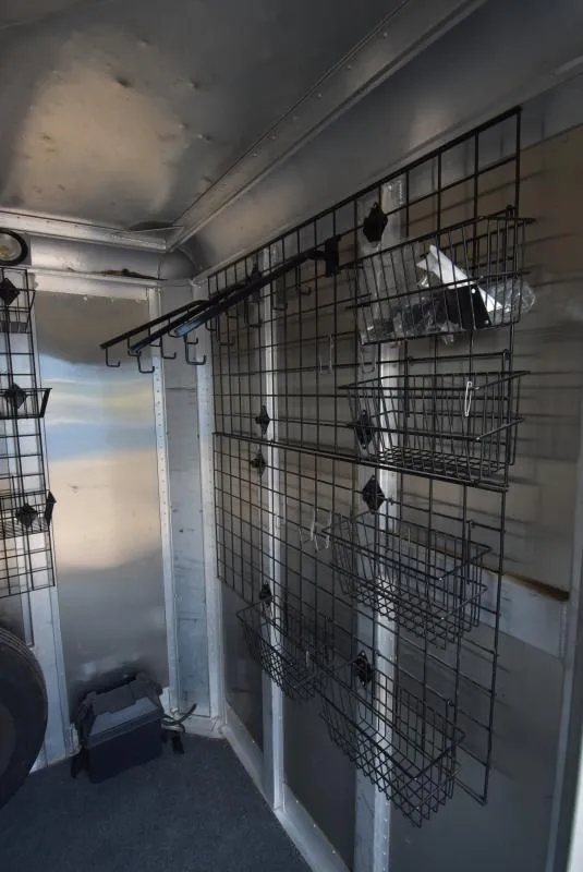2008 C and C Trailers 4 Horse Bumper Pull – Hay Pod – Side view of interior tack room storage racks and hanging basket organizers