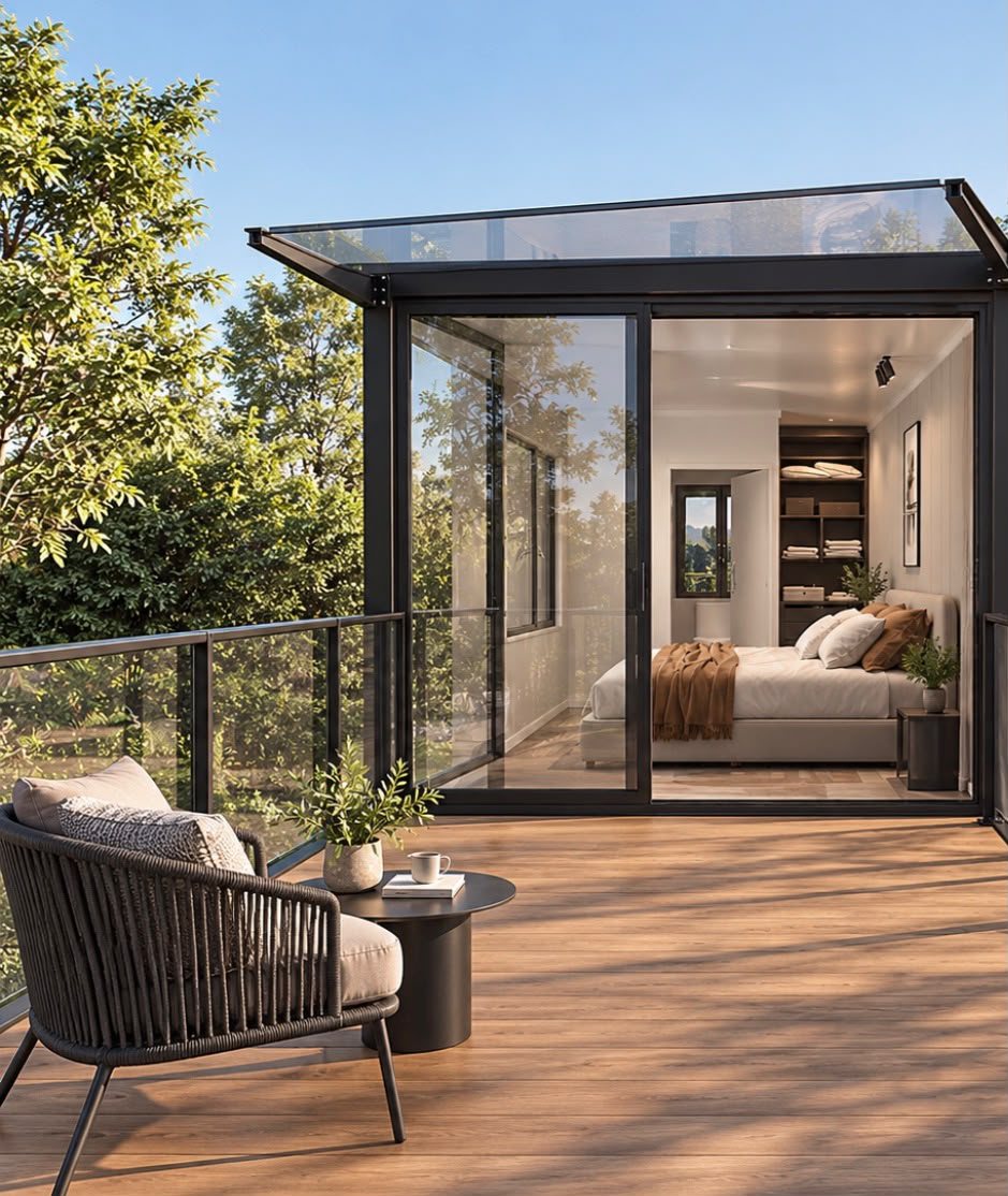 Two-Story Container Home – 1 Bedroom, 2 Baths, Rooftop Deck – Upper terrace seating with glass railing and glazed bedroom doors — furniture and appliances shown for illustration only; not included