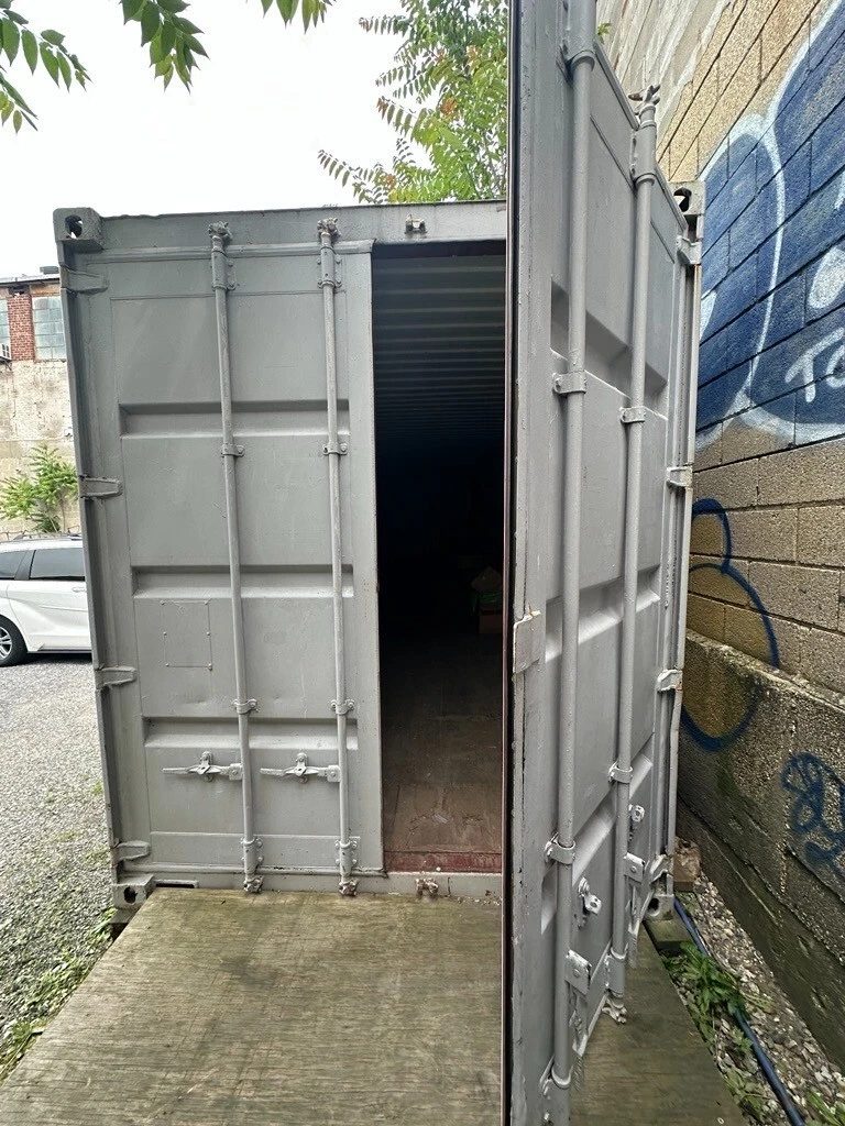 40ft High Cube Shipping Container – Used, Double Rear Doors – grey container entrance with one cargo door open