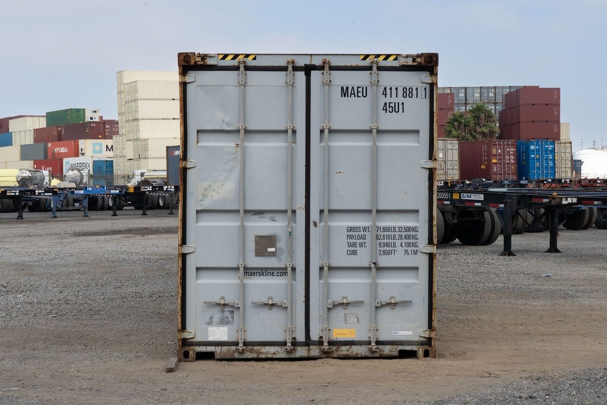 20ft Cargo-Worthy Open Top Container – Removable Tarp Roof – straight-on view of closed cargo doors in container yard