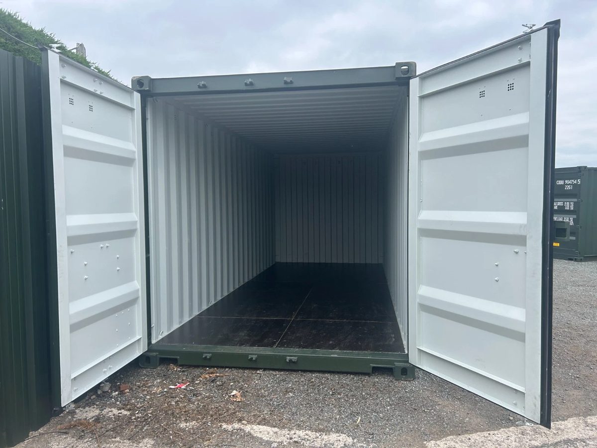 20ft New Shipping Container – One-Trip, Double Doors – open cargo doors revealing empty container with dark flooring