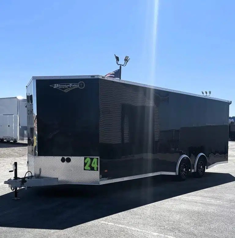 2026 Millennium 24 ft Blaze Car Hauler – Black Aluminum – Exterior view showing the front V-nose and side of the black trailer