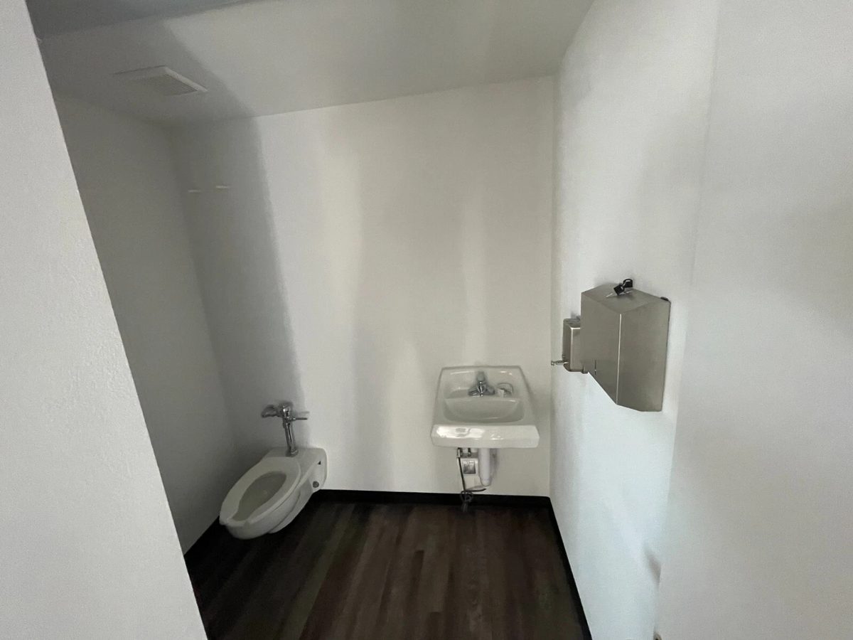 40ft Converted Container Office – Accessible Restroom – Restroom with wall-mounted toilet, sink and stainless steel dispensers