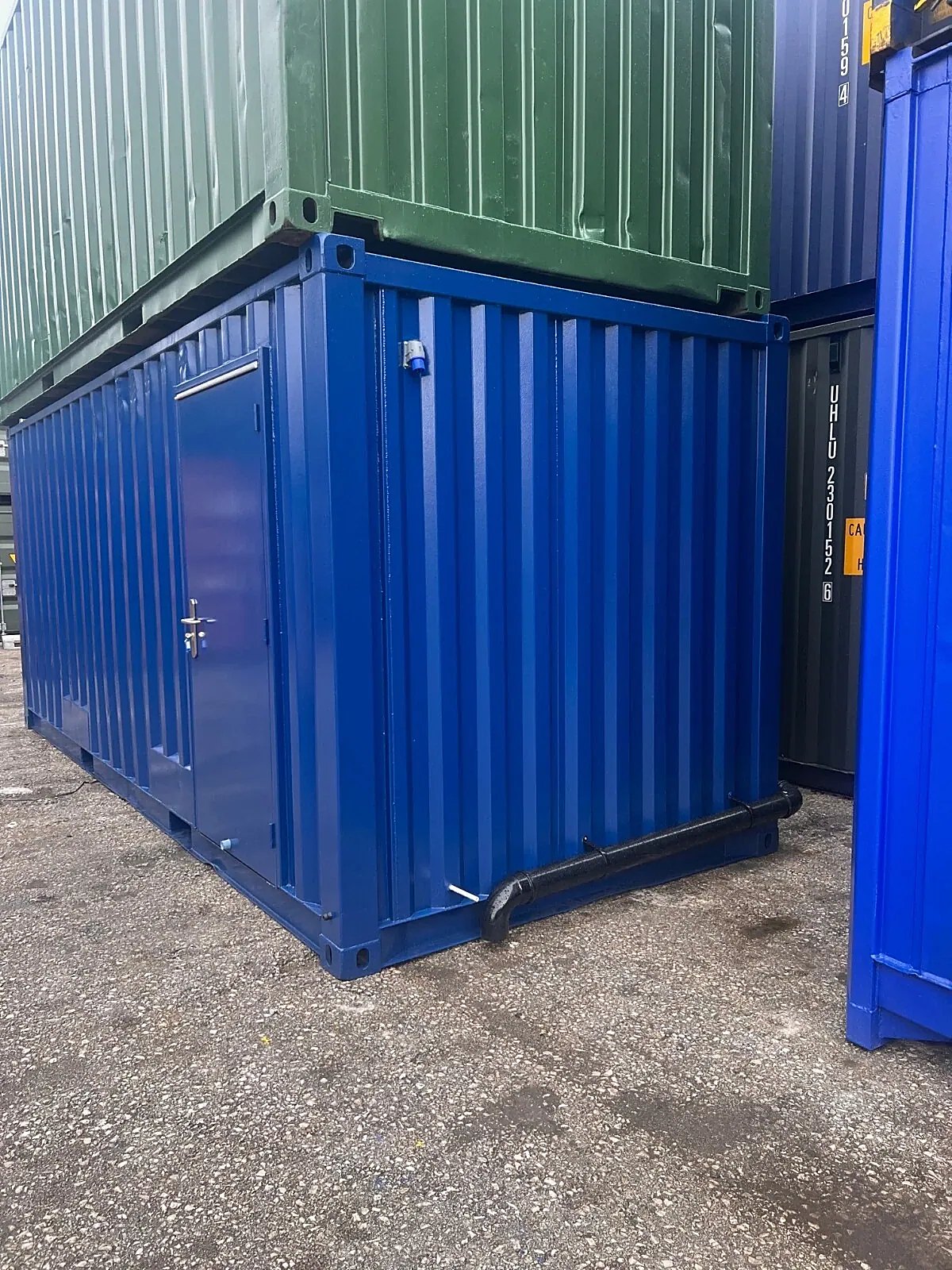 20ft Refurbished Container Toilet Block – Separate Compartments – blue toilet block with side entrance and external drainage pipe