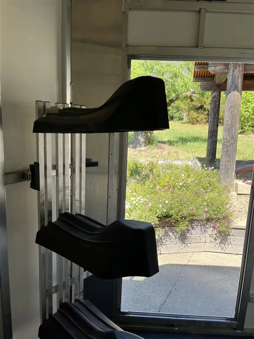 2013 Sundowner Sportsman 3 Horse Trailer – Extra-Large Tack Room – Interior of the tack room showing a swing-out saddle rack with two tiers