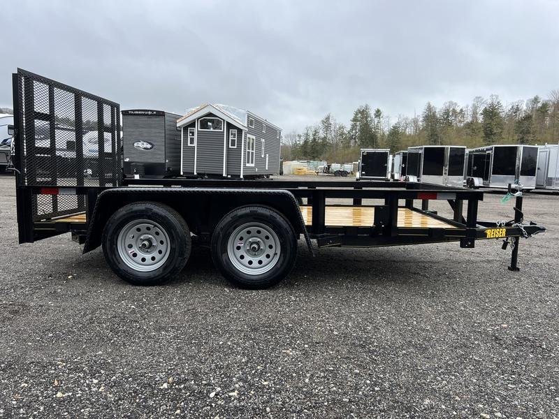 2024 Reiser Trailers 12 ft Landscape Trailer – Ramp Gate – Direct side profile of the utility trailer against a background of other units