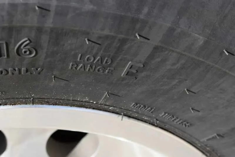 2018 Lakota 4 Horse Trailer – 2 ft Short Wall – Close up of a tire sidewall showing the load range E marking
