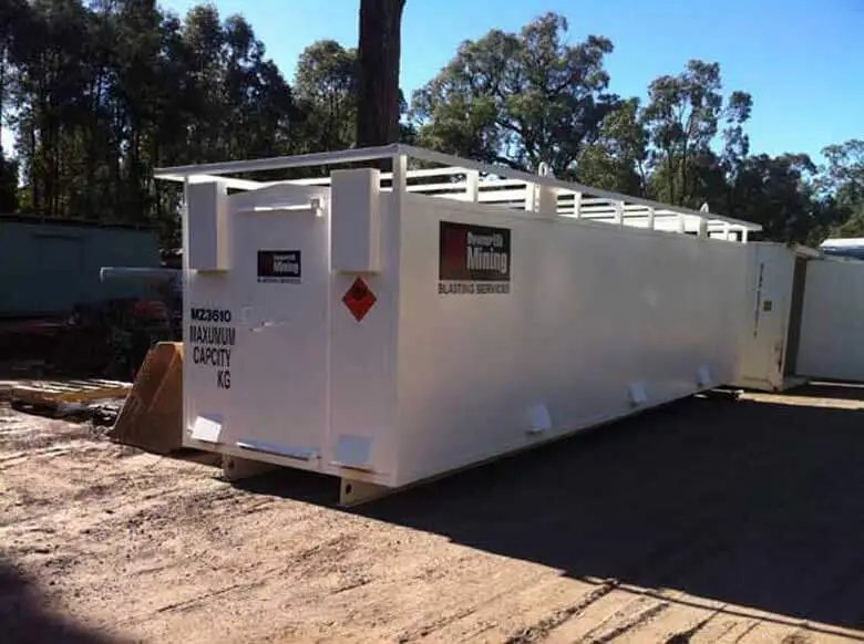 Explosive Storage Magazine – White, Insulated – Three-quarter exterior view of a long white insulated storage container outdoors