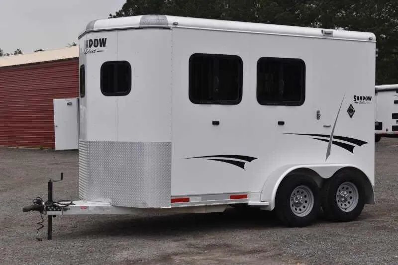 2013 Shadow 2HSL 2 Horse Trailer – Aluminum, Dressing Room – Three-quarter front-left view of the white horse trailer against a gray background