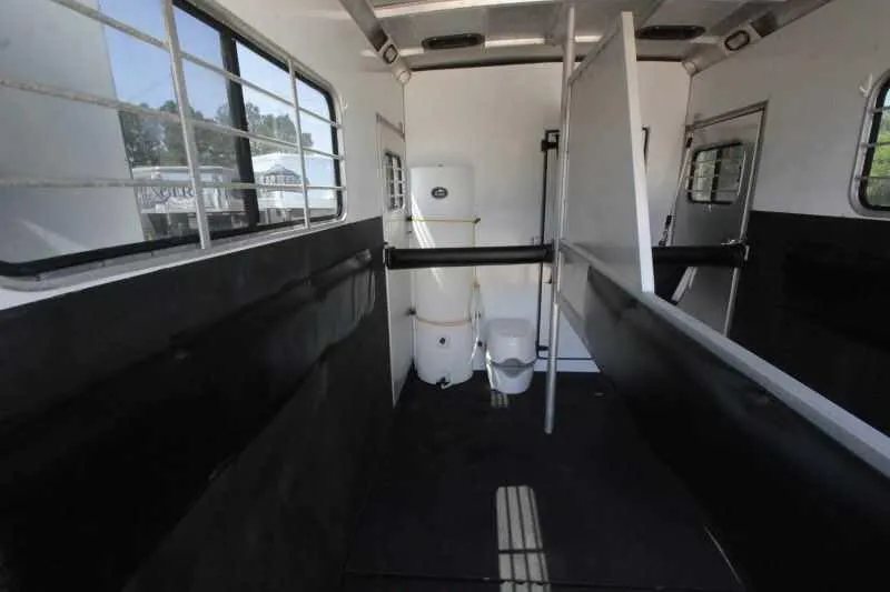 1999 Sundowner 20 ft Horse Trailer – Weekender – Inside horse stalls looking forward towards a water tank and storage