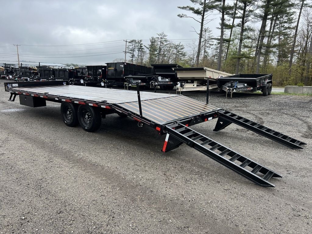 2024 Diamond C 24 ft Deckover – Blackwood Deck – Three-quarter rear view of the trailer with ramps deployed to the ground