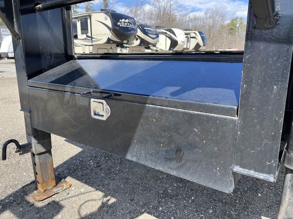 2023 Big Tex 40 ft Equipment Trailer – Slide-Out Ramps – Closed black metal storage box integrated into the gooseneck frame assembly