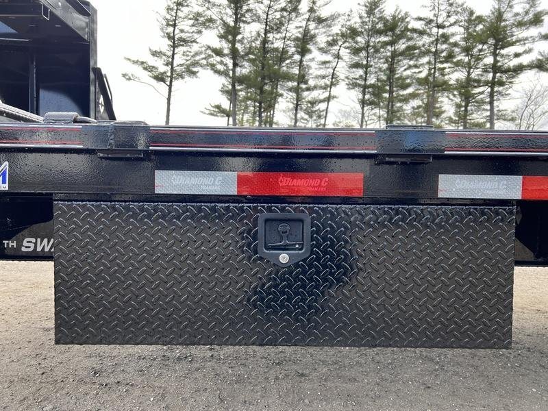 2024 Diamond C 35 ft Equipment Trailer – Auto Dovetail – Closed side-mounted black diamond-plate tool box on the trailer frame