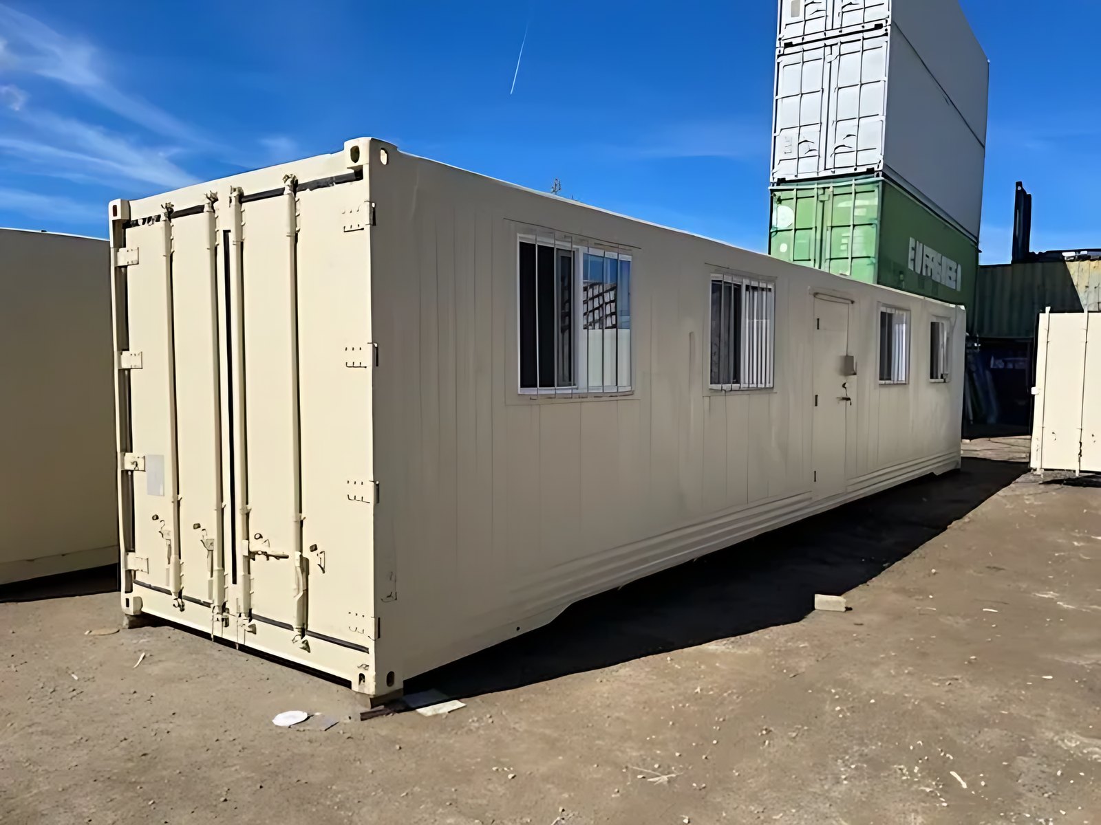 40ft Converted Office Container – Insulated, Four Barred Windows – Cream converted container with closed cargo doors, four barred windows and side entrance