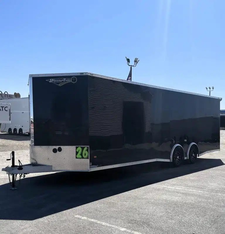 2026 Millennium 26 ft Car Hauler – Black Aluminum – Front three-quarter view of the trailer showing the hitch and side walls