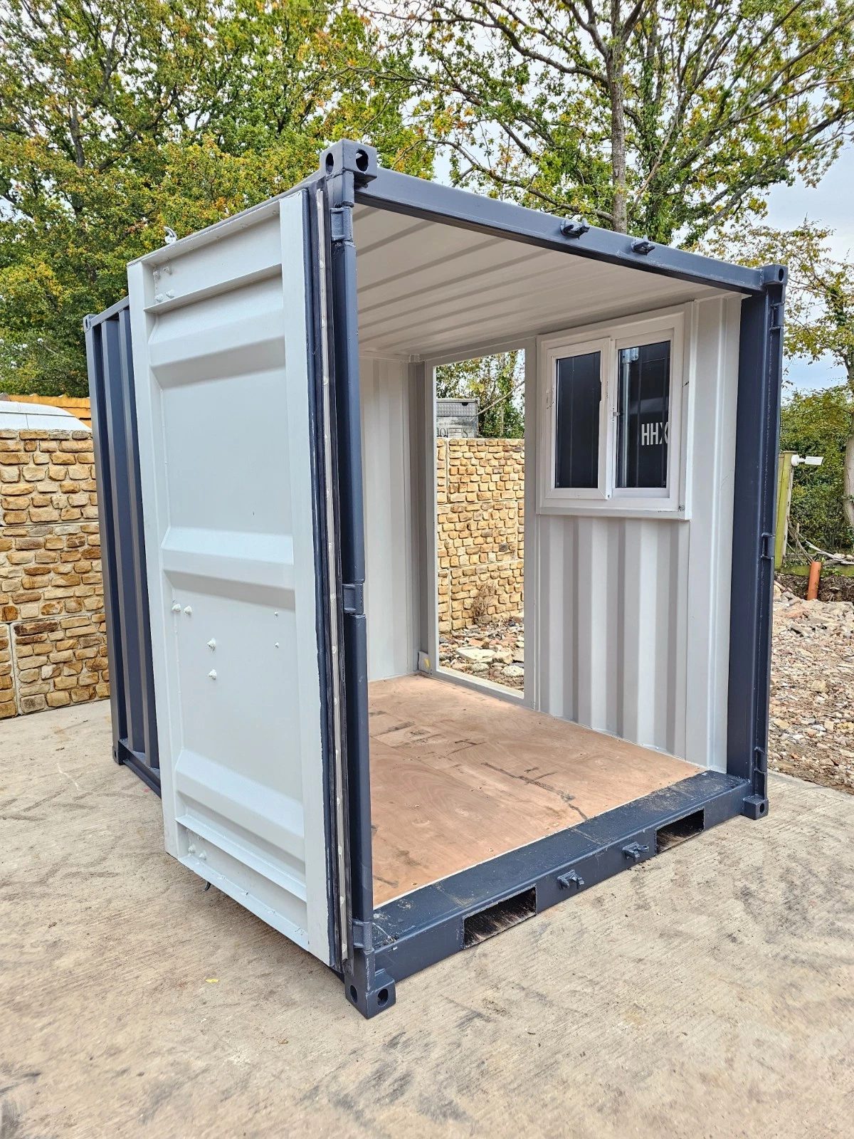 8ft New Shipping Container – Lockbox and Barred Windows – open container entrance showing empty interior and fitted window