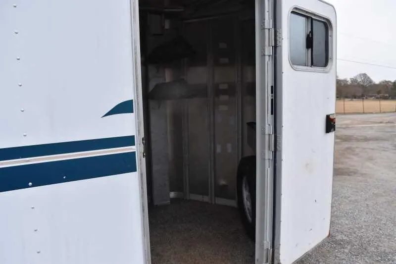 1995 Featherlite 2 Horse Trailer – Aluminum, Dressing Room – View through the open side entry door into the storage area
